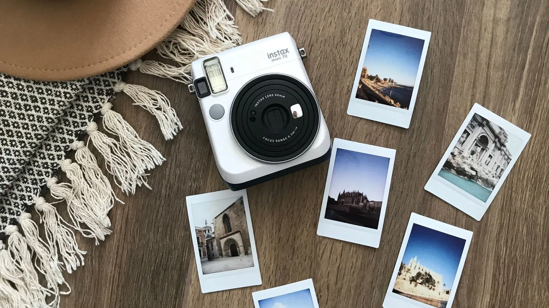 Instax Mini 9 instant camera with polaroid film, showcasing its compact design and vibrant color options.