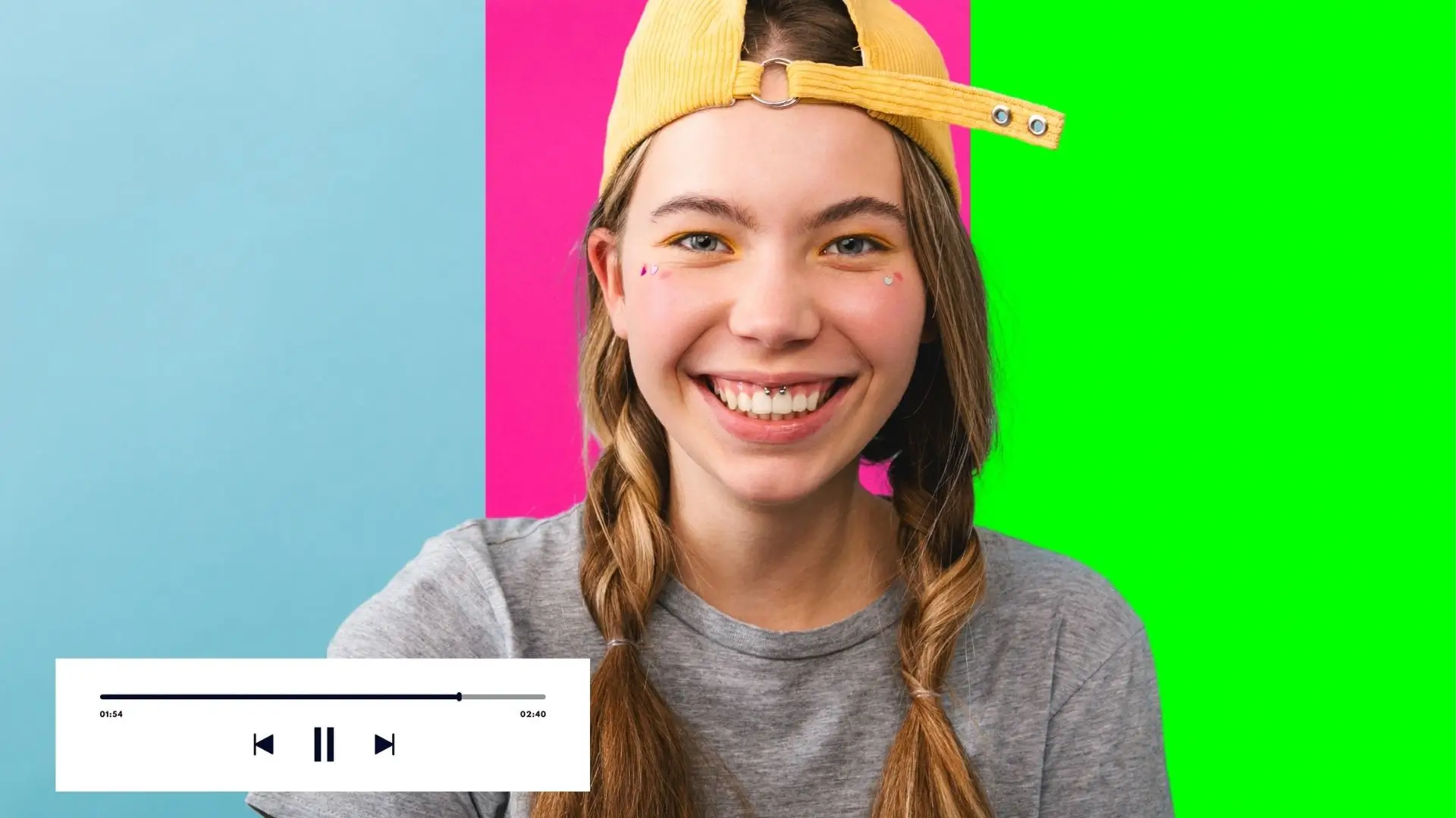 A girl with a hat smiles brightly against a vibrant green and pink background.